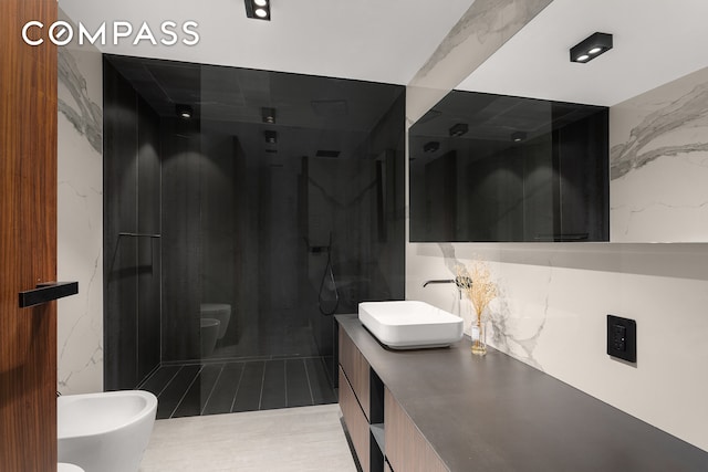 619 E 6th St Unit 4, New York City, NY 10009 - bathroom featuring a bidet, vanity, a marble finish shower, and toilet