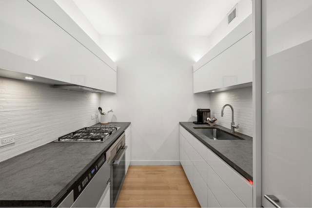 241 5th Ave Unit 5C, New York City, NY 10016 - kitchen featuring a sink, dark countertops, stainless steel appliances, and modern cabinets