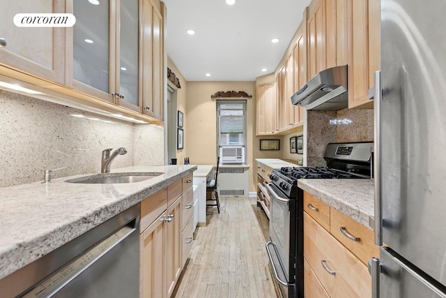 520 E 90th St Unit 2B, New York City, NY 10128 - kitchen with stainless steel appliances, range hood, light brown cabinetry, and recessed lighting