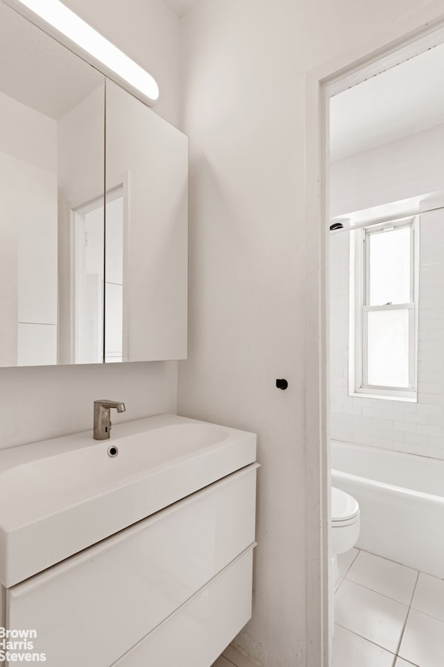 60 E 8th St Unit 12N, New York City, NY 10003 - full bathroom with vanity, tile patterned floors, and bathtub / shower combination