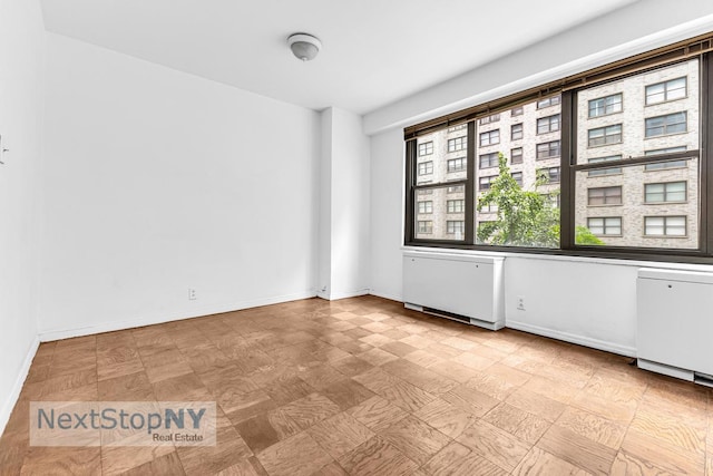 220 E 57th St Unit 4F, New York City, NY 10022 - unfurnished room with tile patterned floors and baseboards