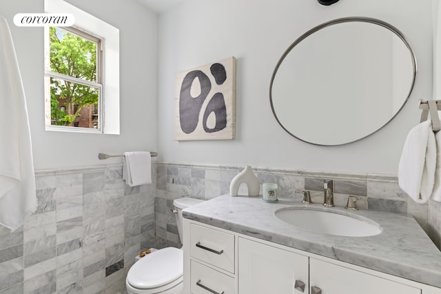 415 9th St Unit 41, New York City, NY 11215 - half bath featuring tile walls, vanity, toilet, and wainscoting