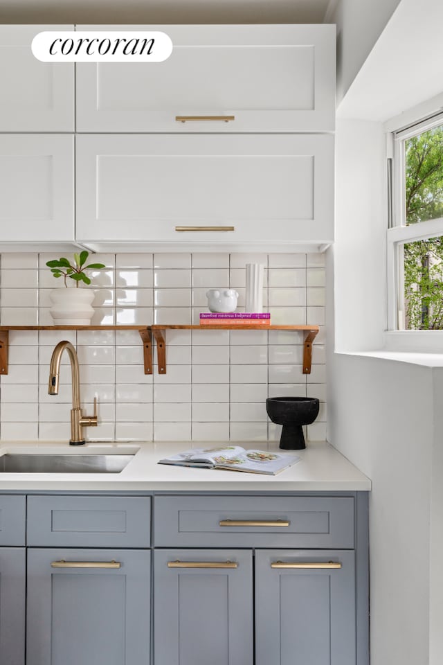 415 9th St Unit 41, New York City, NY 11215 - kitchen featuring gray cabinetry, a sink, and tasteful backsplash