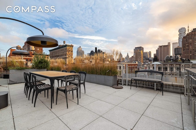63 Greene St Unit 2D, New York City, NY 10012 - view of patio featuring a skyline view and outdoor dining area