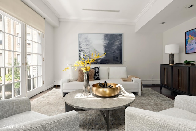 2 E 80th St Unit 7, New York City, NY 10075 - living room featuring healthy amount of natural light, wood finished floors, baseboard heating, ornamental molding, and baseboards