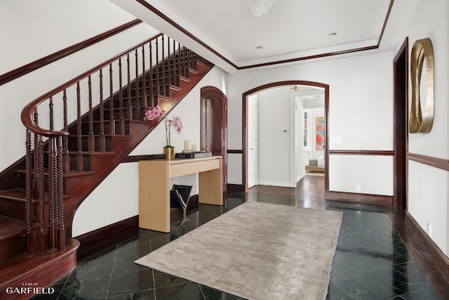 2 E 80th St Unit 7, New York City, NY 10075 - entryway featuring granite floors, baseboards, arched walkways, and stairs
