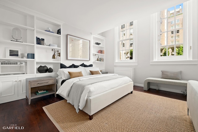 2 E 80th St Unit 7, New York City, NY 10075 - bedroom with dark wood-style floors and multiple windows