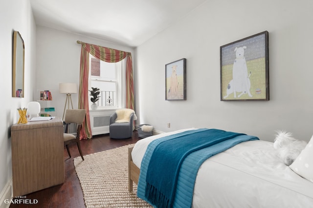 2 E 80th St Unit 7, New York City, NY 10075 - bedroom featuring radiator, dark wood-type flooring, and baseboards