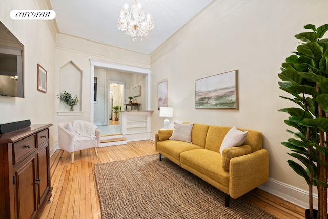 62 E 87th St Unit 1B, New York City, NY 10128 - living area featuring light wood-type flooring, a chandelier, and baseboards