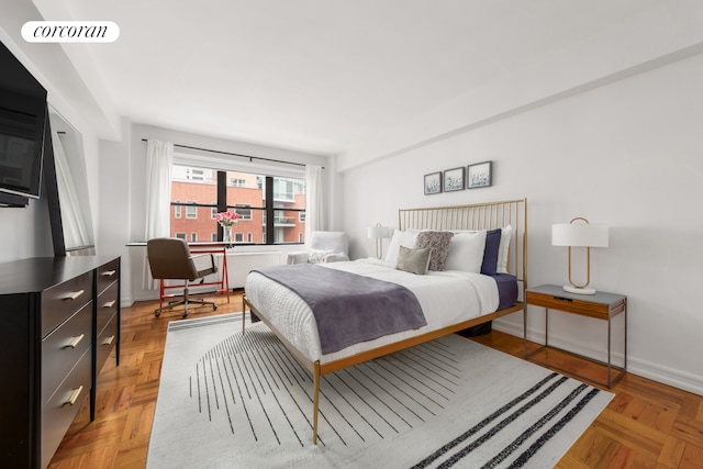 301 E 48th St Unit 6G, New York City, NY 10017 - bedroom featuring an office area and baseboards