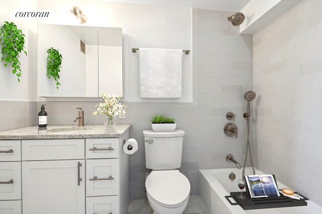 1991 Broadway Ph Ph, New York City, NY 10023 - full bathroom with vanity, toilet, bathing tub / shower combination, and tile walls