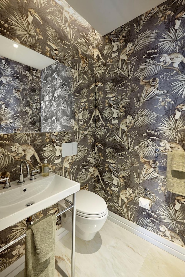 200 E 59th St Unit 26D, New York City, NY 10022 - bathroom featuring wallpapered walls and toilet