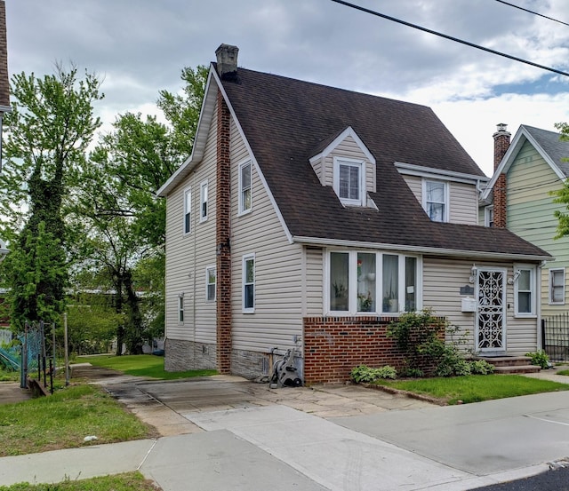 193-32 Williamson Ave, New York City, NY 11413 - view of front of home with a chimney