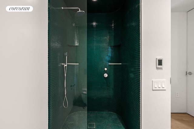 9 Chapel St Unit 9A, New York City, NY 11201 - bathroom with a walk in shower and wood finished floors