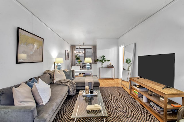 222 E 35th St Unit 1-E, New York City, NY 10016 - living area featuring a chandelier, ornamental molding, and light wood-type flooring