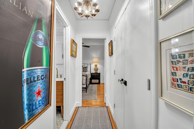 222 E 35th St Unit 1-E, New York City, NY 10016 - corridor featuring a chandelier and wood finished floors