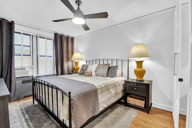 222 E 35th St Unit 1-E, New York City, NY 10016 - bedroom featuring cooling unit, wood finished floors, and a ceiling fan