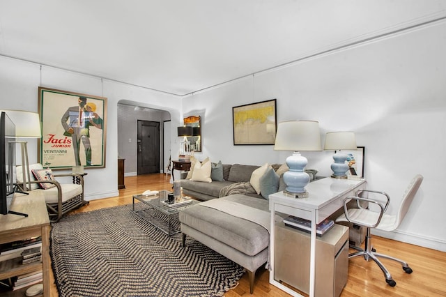 222 E 35th St Unit 1-E, New York City, NY 10016 - living room with an office area and wood finished floors