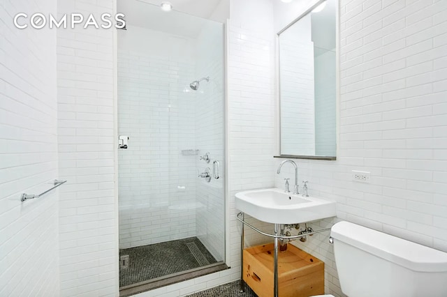 37 Warren St Unit 3C, New York City, NY 10007 - bathroom featuring tile walls and a stall shower