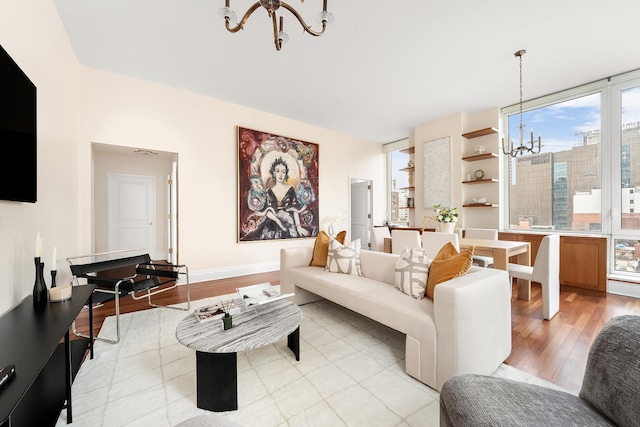 300 E 77th St Unit 10C, New York City, NY 10075 - living room with a chandelier and light wood-style flooring