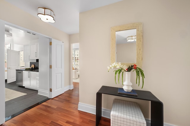 300 E 77th St Unit 10C, New York City, NY 10075 - corridor featuring dark wood finished floors and baseboards