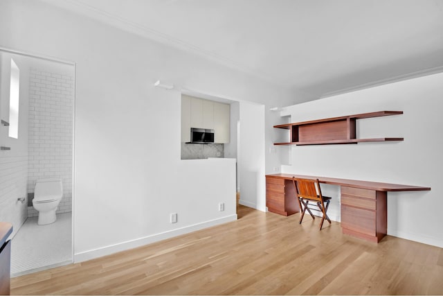 253 W 16th St Unit 6D, New York City, NY 10011 - unfurnished living room with light wood-type flooring and baseboards