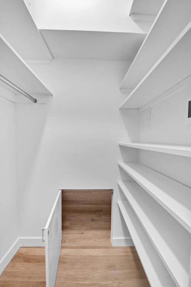 253 W 16th St Unit 6D, New York City, NY 10011 - walk in closet with wood finished floors