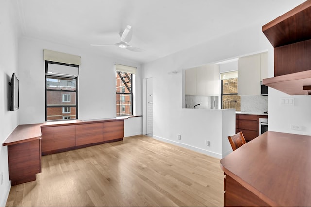 253 W 16th St Unit 6D, New York City, NY 10011 - unfurnished office with light wood-type flooring, ceiling fan, and baseboards