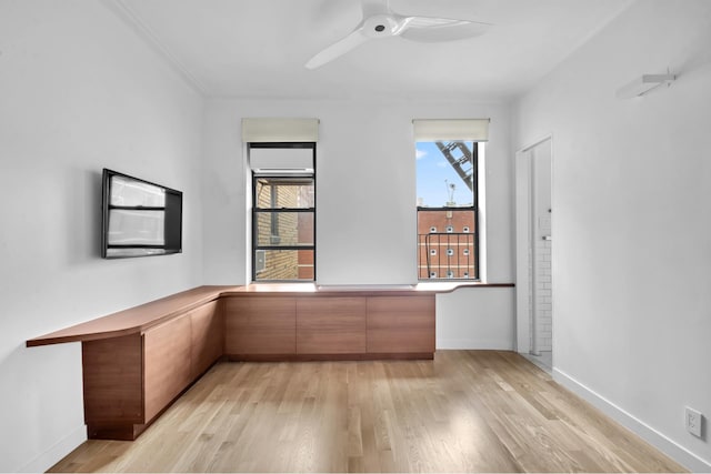 253 W 16th St Unit 6D, New York City, NY 10011 - unfurnished room with light wood-style flooring, an office area, a ceiling fan, and baseboards