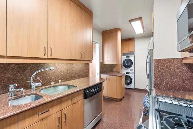 60 E End Ave Unit 27B, New York City, NY 10028 - kitchen featuring appliances with stainless steel finishes, stacked washer / drying machine, granite floors, light stone countertops, and light brown cabinets