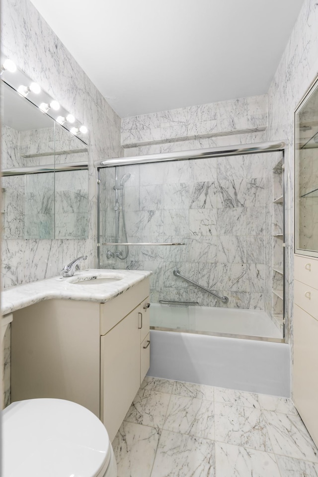 60 E End Ave Unit 27B, New York City, NY 10028 - bathroom featuring vanity, shower / bath combination with glass door, and marble finish flooring