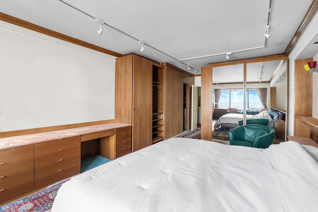 60 E End Ave Unit 27B, New York City, NY 10028 - bedroom featuring rail lighting and access to exterior