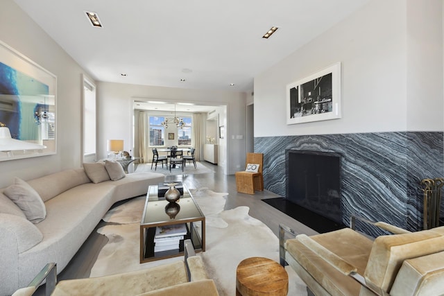 465 W 23rd St Unit 19D, New York City, NY 10011 - living area featuring a chandelier and wood finished floors
