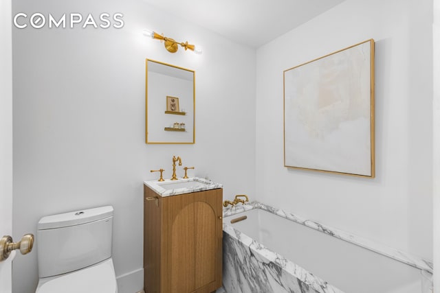 135 E 83rd St Unit 8/9C, New York City, NY 10028 - bathroom with vanity, a bath, and toilet
