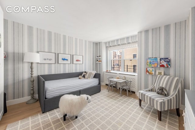 135 E 83rd St Unit 8/9C, New York City, NY 10028 - bedroom with wood finished floors and wallpapered walls