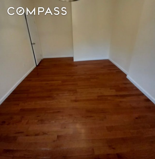 495 Linwood St, New York City, NY 11208 - bedroom featuring wood finished floors and a chandelier