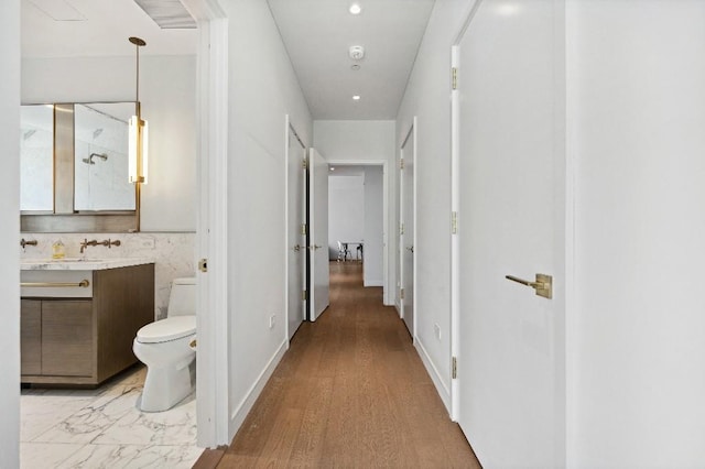 305 E 51st St Unit 20-B, New York City, NY 10022 - hallway with a sink and recessed lighting