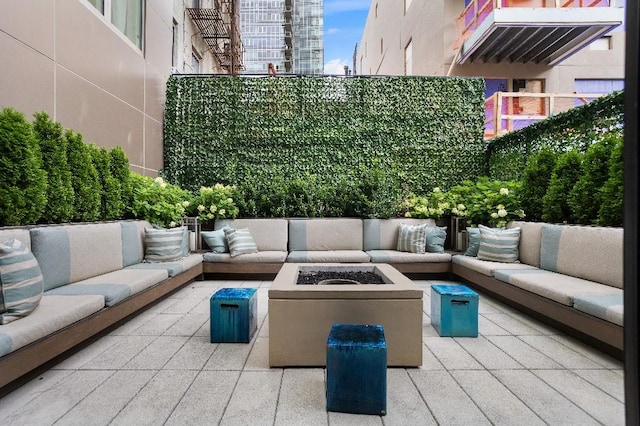 305 E 51st St Unit 20-B, New York City, NY 10022 - view of patio with an outdoor living space with a fire pit