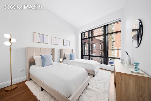 150 Charles St Unit 4An, New York City, NY 10014 - bedroom with wood finished floors, vaulted ceiling, and baseboards