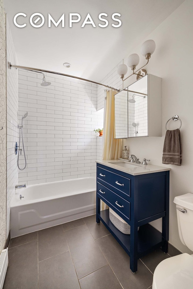 702 E 5th St Unit 5E, New York City, NY 10009 - full bathroom with shower / bath combo with shower curtain, toilet, vanity, tile patterned floors, and a baseboard heating unit