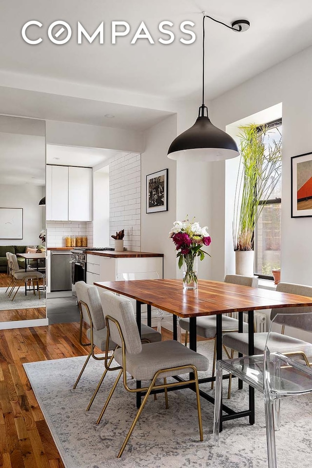 702 E 5th St Unit 5E, New York City, NY 10009 - dining space featuring wood finished floors