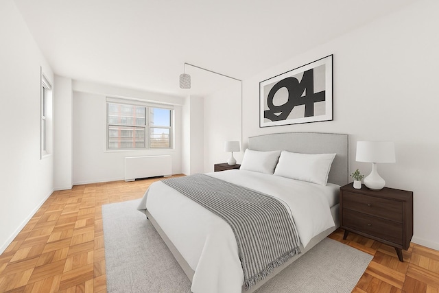 300 E 40th St Unit 24P, New York City, NY 10016 - bedroom with radiator and baseboards