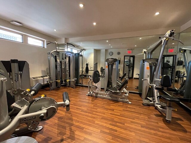 300 E 40th St Unit 24P, New York City, NY 10016 - workout area with wood finished floors and recessed lighting
