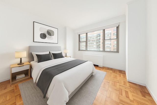 300 E 40th St Unit 24P, New York City, NY 10016 - bedroom with radiator heating unit and baseboards