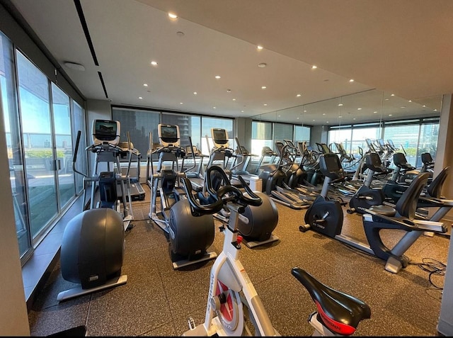 300 E 40th St Unit 24P, New York City, NY 10016 - gym with healthy amount of natural light and recessed lighting