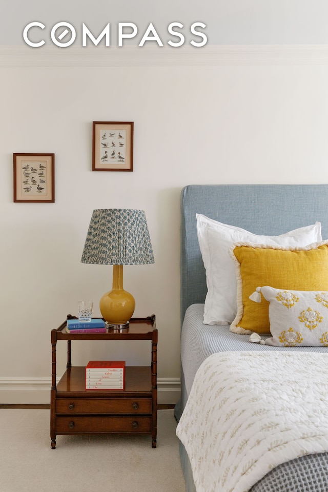 174 E 74th St Unit 3A, New York City, NY 10021 - bedroom featuring ornamental molding, baseboards, and carpet floors