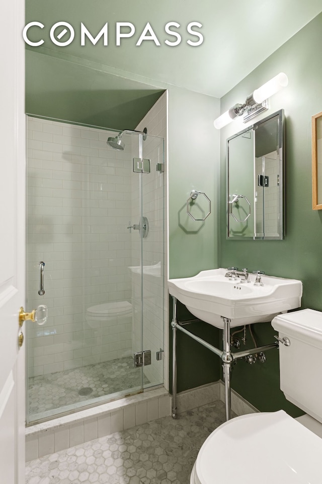174 E 74th St Unit 3A, New York City, NY 10021 - full bathroom with toilet, a stall shower, and tile patterned flooring
