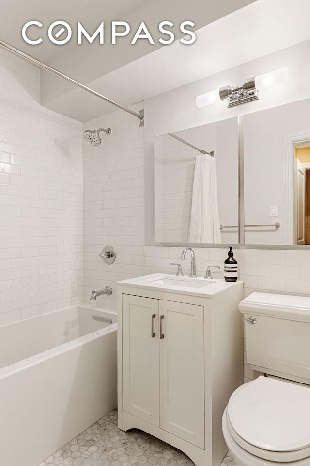 174 E 74th St Unit 3A, New York City, NY 10021 - full bath with shower / bath combo with shower curtain, vanity, toilet, and tile walls
