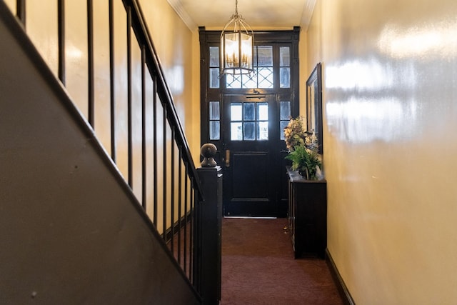 344 E 58th St Unit A, New York City, NY 10022 - entrance foyer featuring dark colored carpet, crown molding, a chandelier, and stairs
