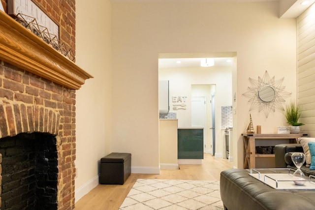 344 E 58th St Unit A, New York City, NY 10022 - living area with light wood-style flooring, a fireplace, and recessed lighting